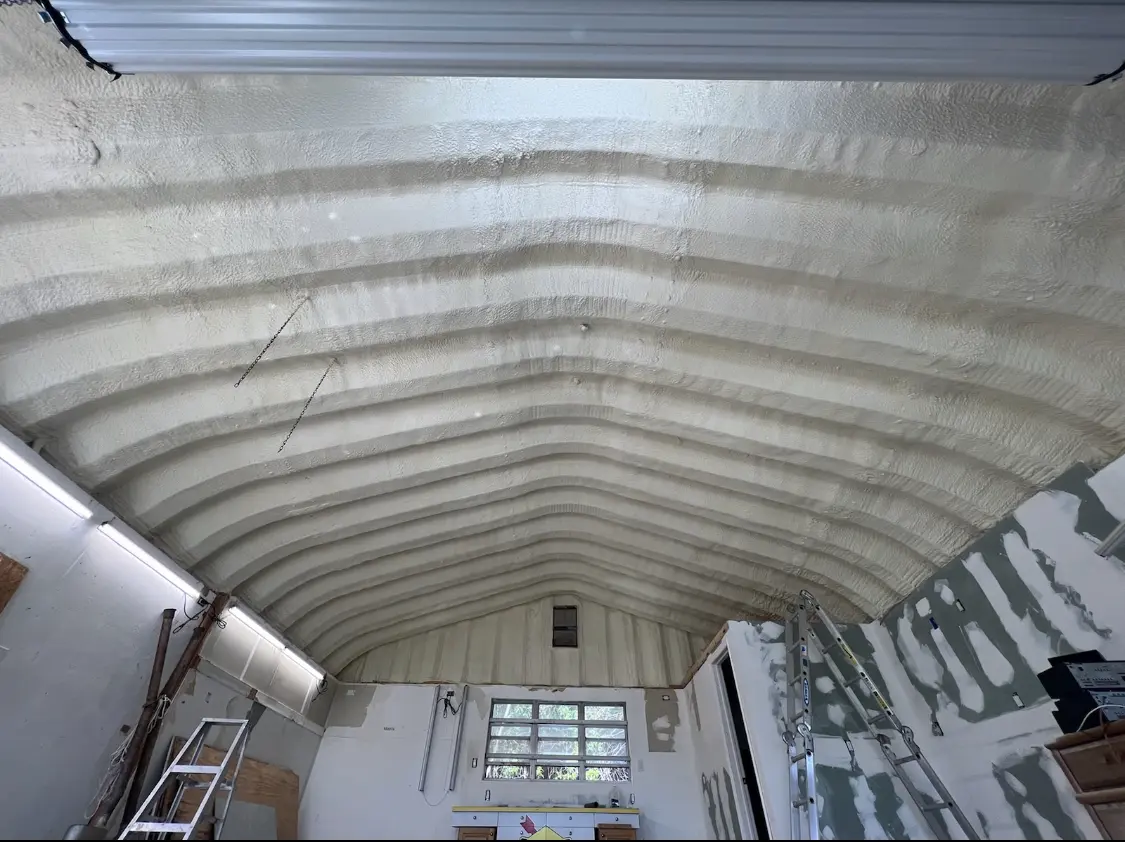 Spray polyurethane foam applied to the underside of a metal roof deck in El Segundo